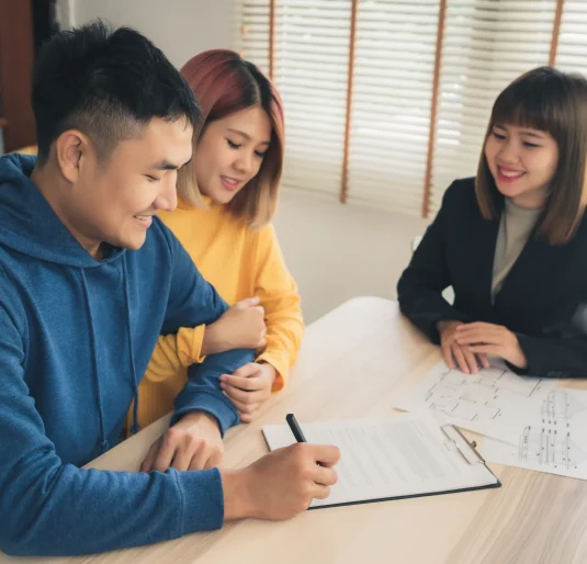 happy-young-asian-couple-realtor-agent